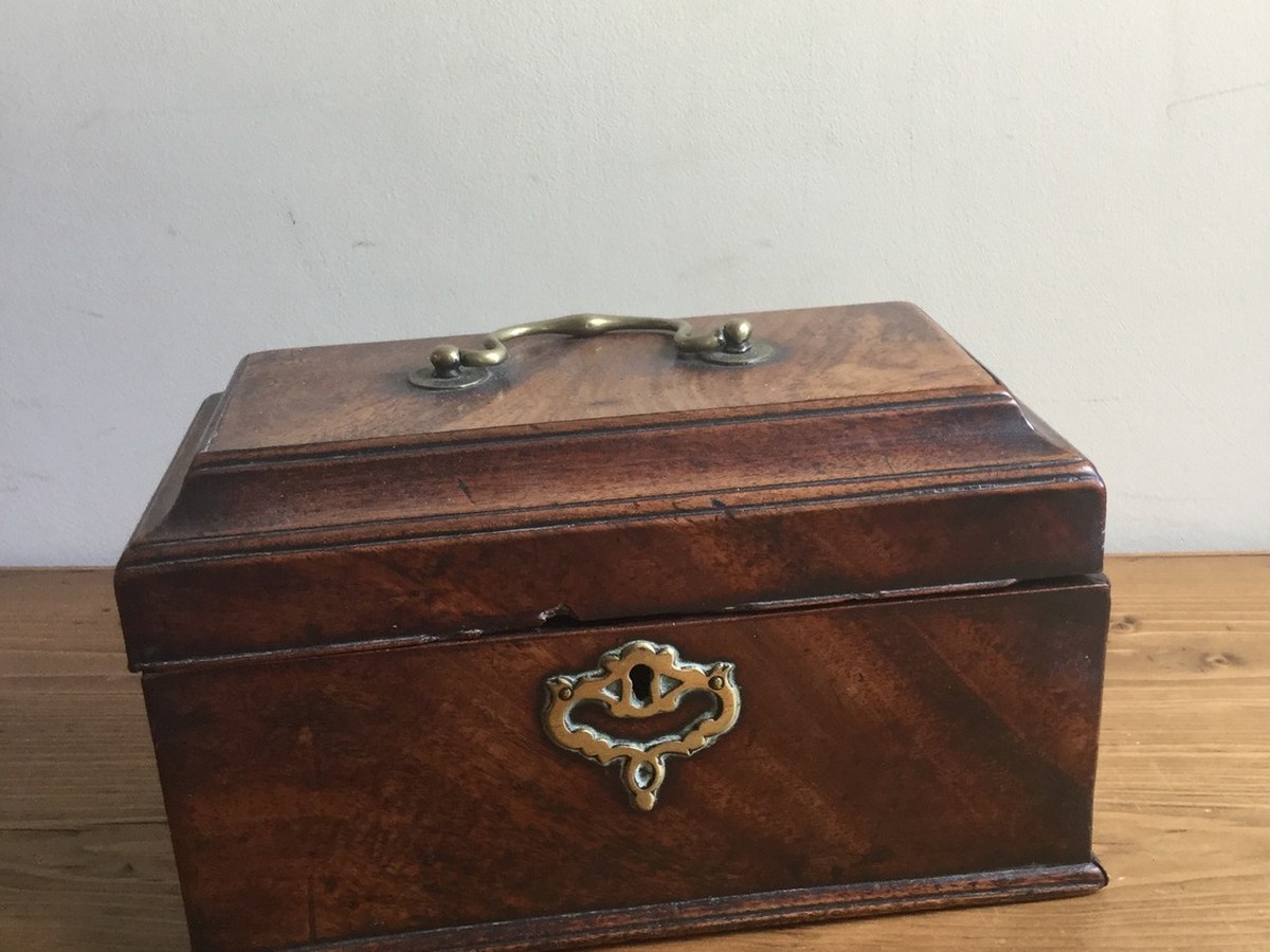 An antique mahogany box consigned from a house clearance